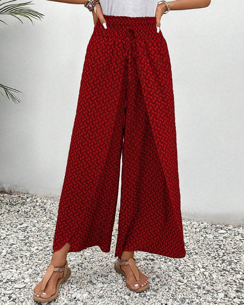 Damenhose in Rot mit geometrischem Muster, weites Bein, hoher Bund. Perfekt für Sommermode, lässiger Stil, bequem und stilvoll.