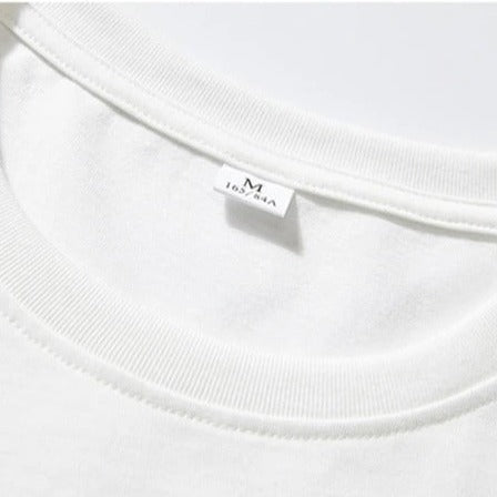 Weißes T-Shirt aus Baumwolle, Größe M, mit Rundhalsausschnitt. Hochwertiges Basic-Kleidungsstück, ideal für lässige Outfits und Alltagsmode.