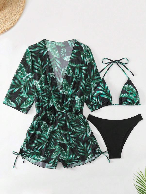 Damen-Badeanzug-Set mit tropischem Blattmuster, bestehend aus Bikini und passendem Kimono. Perfekt für Strandmode und Sommerurlaub.
