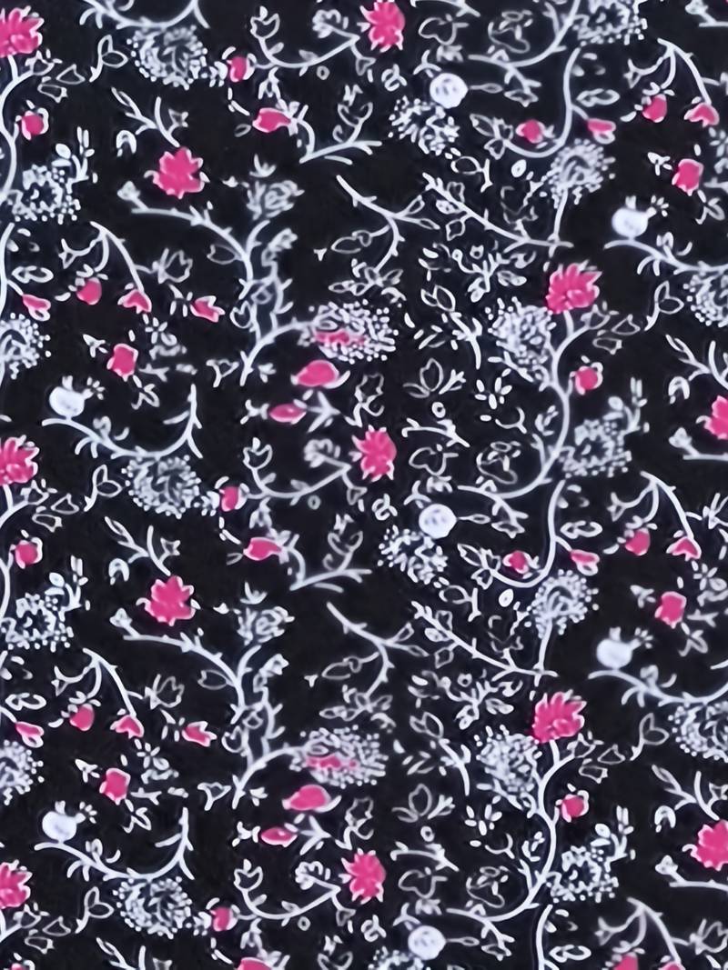 Schwarzer Stoff mit weißem und rotem Blumenmuster, ideal für Mode, Nähen und Dekoration. Hochwertiger Textildruck, florales Design.