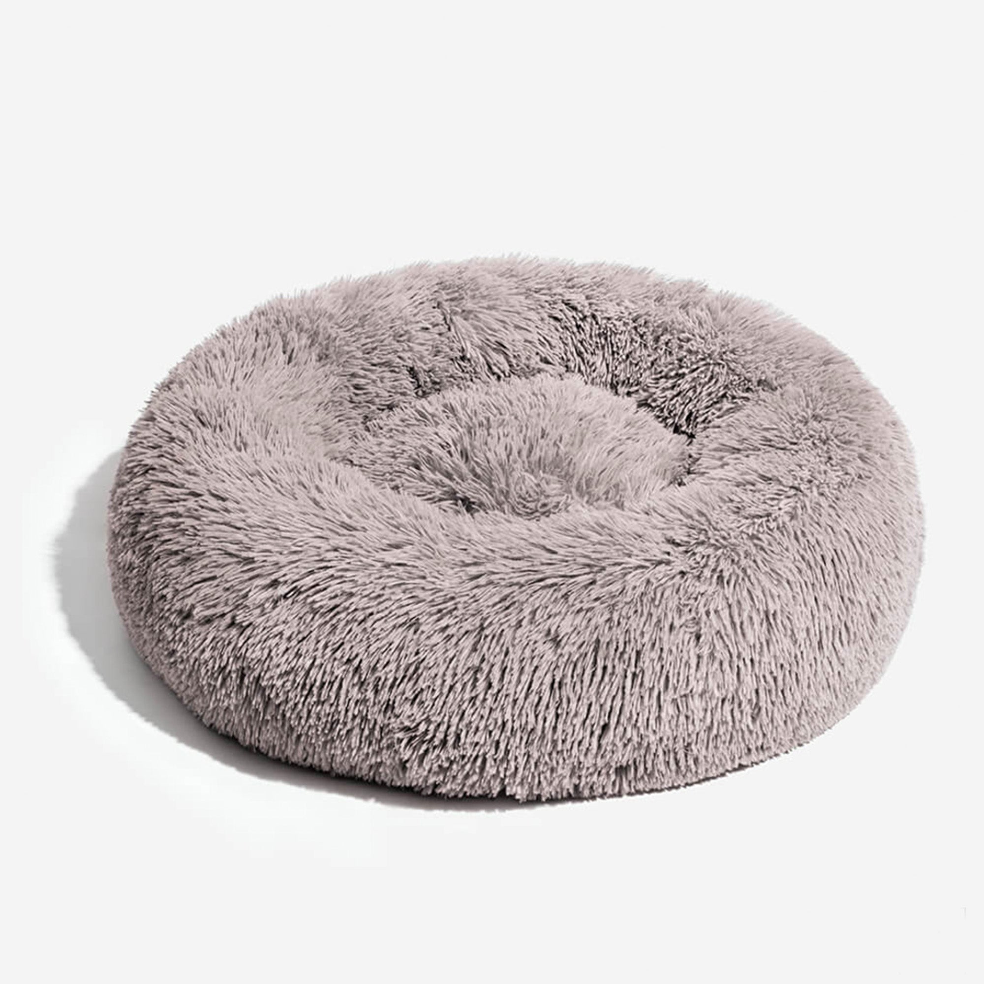 Rundes, flauschiges Hundebett aus grauem Plüsch, gemütlich und weich für Haustiere.