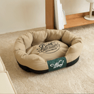 Wasserfestes Hundebett, beige, runde Form, gemütlich, ideal für Haustiere, pflegeleicht.