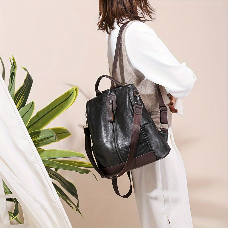 Elegante schwarze Ledertasche, vielseitig als Rucksack oder Umhängetasche tragbar. Perfekt für Damenmode, stilvoll und funktional.