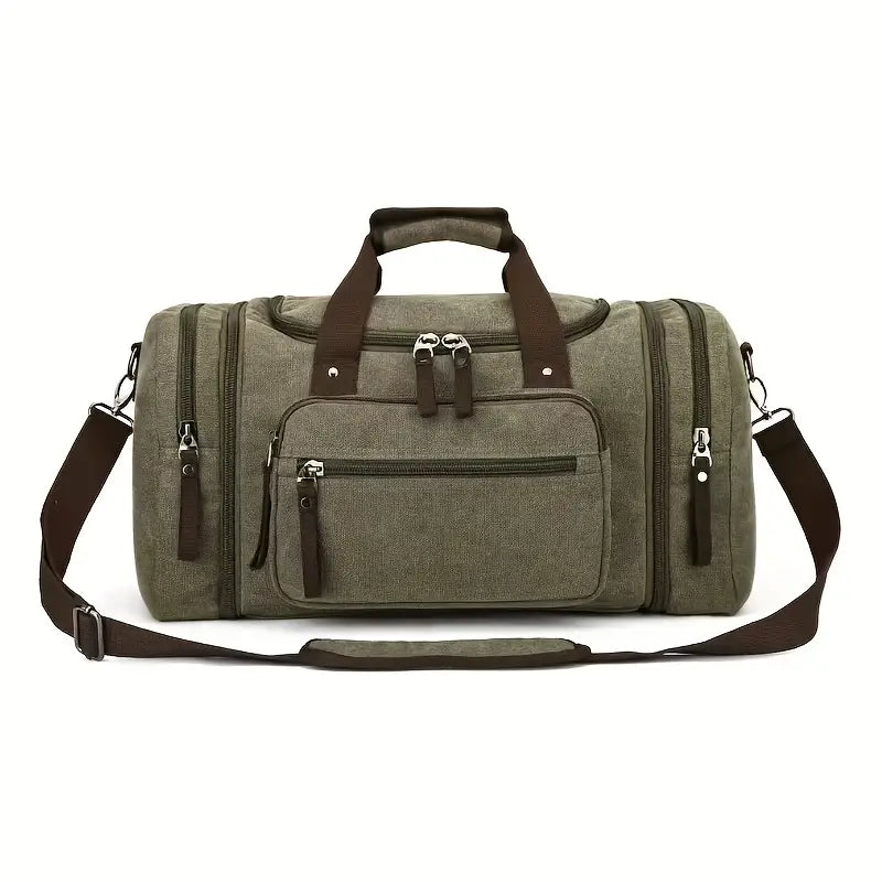 Olivgrüne Reisetasche aus Canvas mit braunen Griffen und Schultergurt, vielseitig und geräumig.