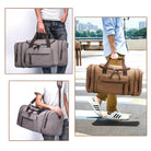 Herren Reisetasche aus Canvas, braun und grau, mit Ledergriffen, ideal für Reisen und Sport.