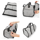Graue faltbare Reisetasche, robustes Material, Reißverschlüsse, praktische Tragetasche.