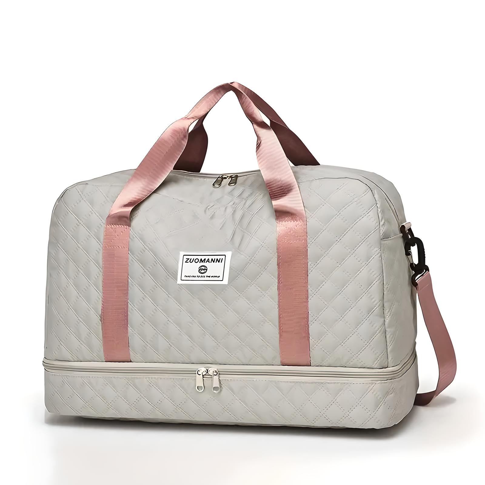 Graue Reisetasche mit rosa Trägern, gestepptem Design, Reißverschluss und Markenlogo.