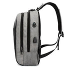 Grauer Laptop-Rucksack mit USB-Anschluss, wasserabweisend, seitliche Reißverschlusstasche.