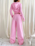 Damen rosa Jogginganzug, Kapuzenpullover und Jogginghose, gemütliche Freizeitmode.