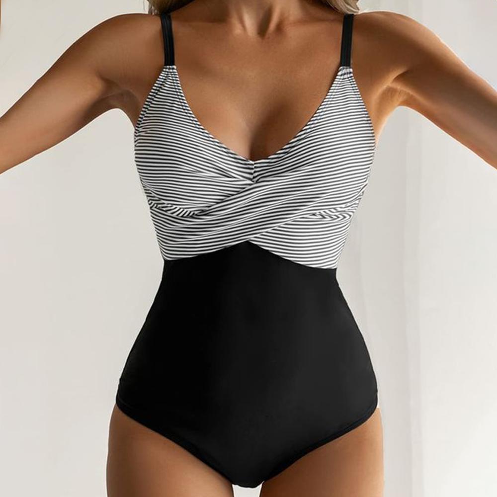 Damen-Badeanzug mit schwarz-weißem Streifenmuster, figurbetont, elegantes Design, ideal für Strandmode und Sommerurlaub.
