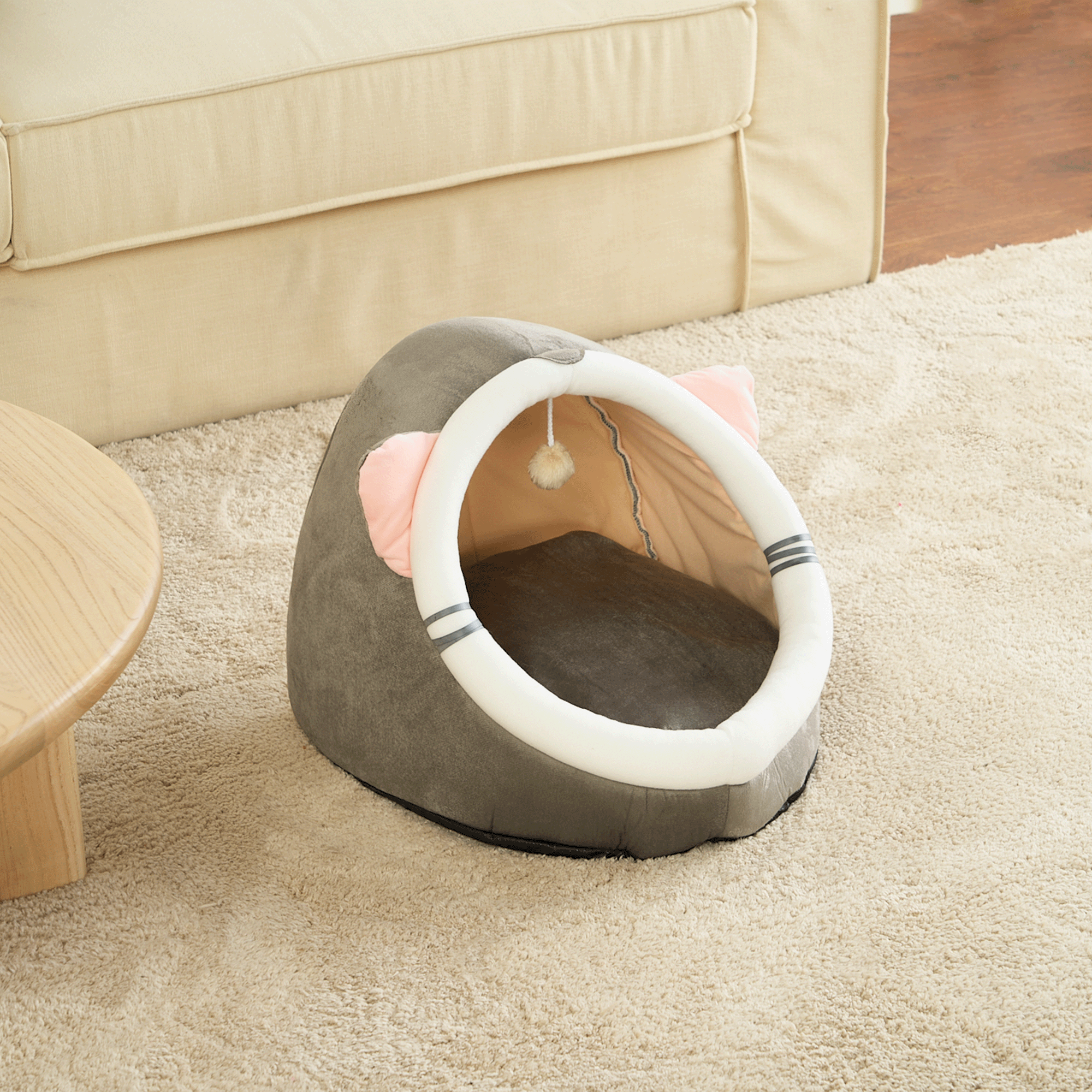 Graues Katzenbett Höhle mit rosa Ohren, weiches Material, ideal für Haustiere, gemütlich.