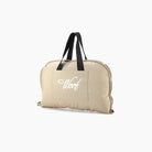 Tragbare faltbare Hundematte beige, mit Griffen, ideal für Reisen und Outdoor-Aktivitäten.