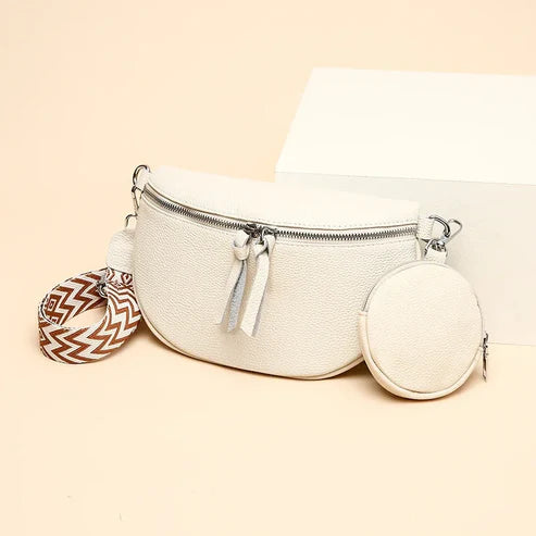 Weiße Lederhandtasche mit Reißverschluss, abnehmbarem Schulterriemen und rundem Münzbeutel. Modische Damenaccessoires, elegant und vielseitig.