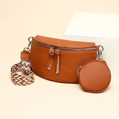 Damen-Ledertasche in Cognacbraun mit abnehmbarem Gurt und rundem Münzbeutel. Modische Umhängetasche, ideal für Alltag und Reisen.