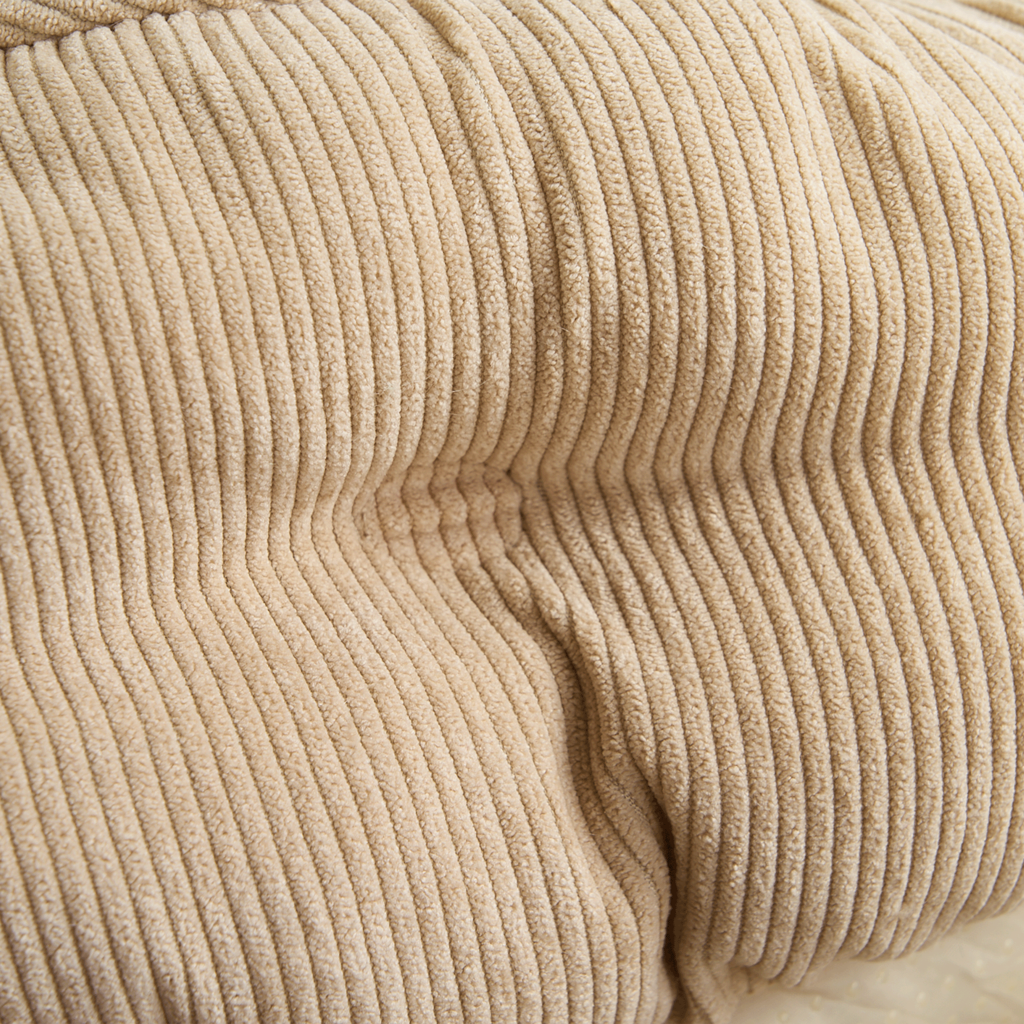 Beiges Cord-Kuschelbett für Haustiere, rund, weich, gemütlich, ideal für Hunde und Katzen.