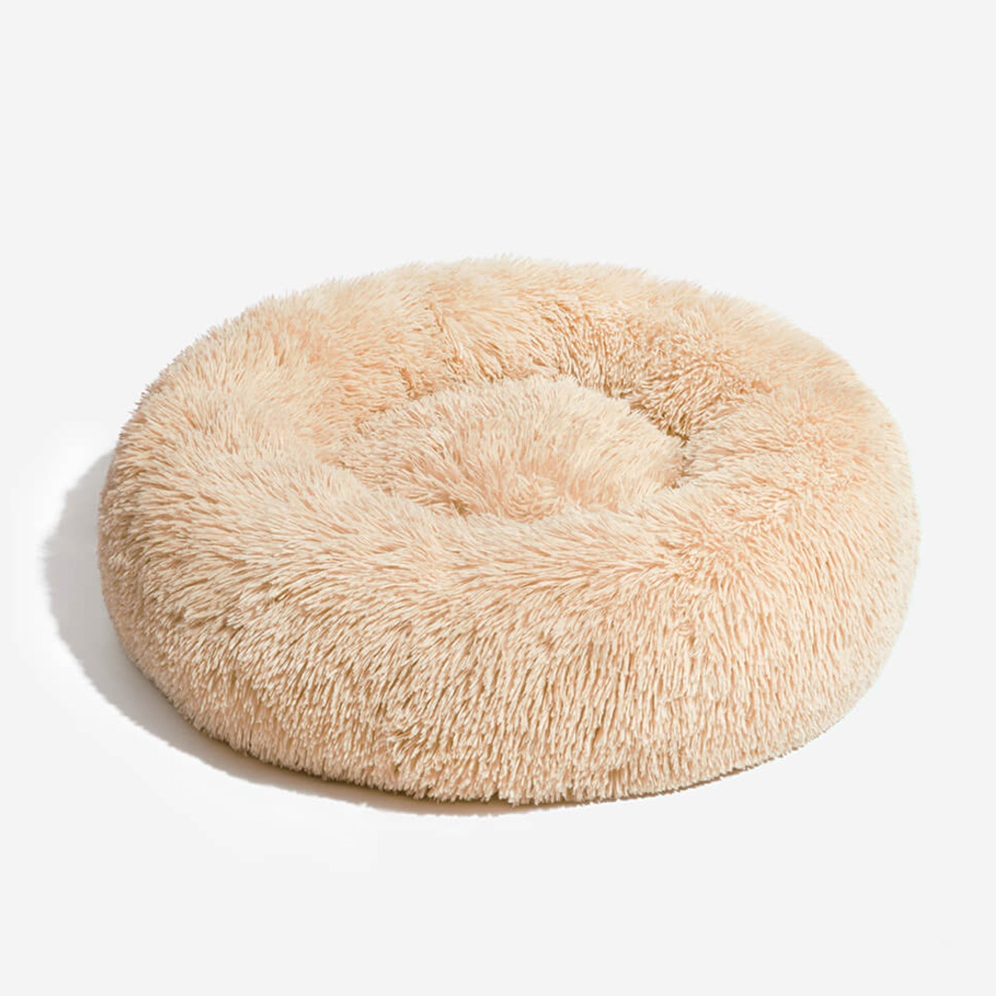 Rundes, flauschiges Hundebett aus Plüsch, beige, gemütlich, ideal für kleine Hunde.