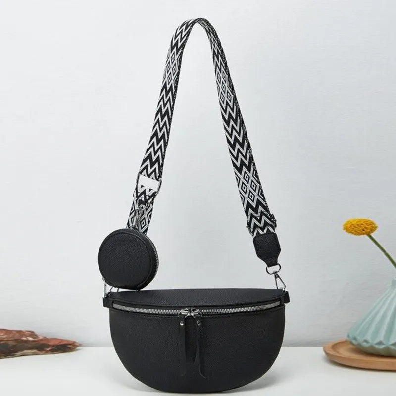 Schwarze Umhängetasche mit geometrischem Riemen und rundem Etui, modisch und praktisch.