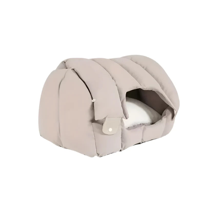 Beiges Katzenbett aus Stoff, gemütlich, mit Kissen, ideal für Haustiere, modernes Design.