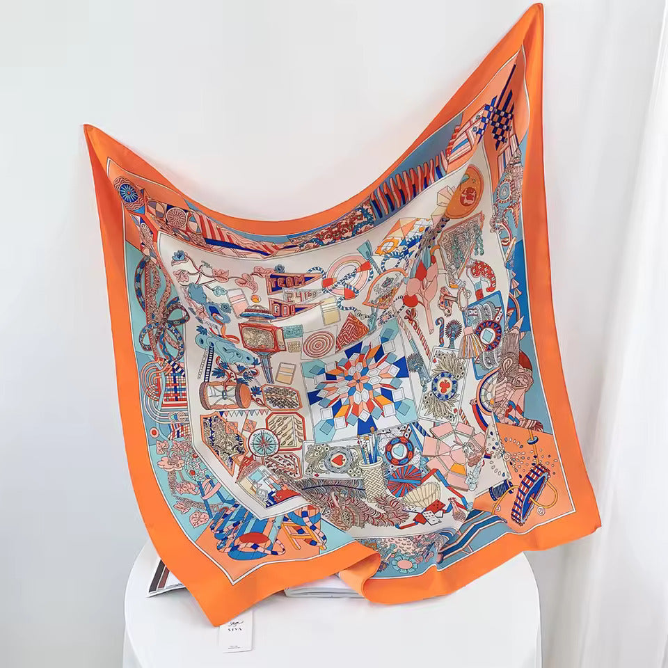 Buntes Seidentuch mit geometrischem Muster, orange-blau, luxuriöses Accessoire, Damenmode.