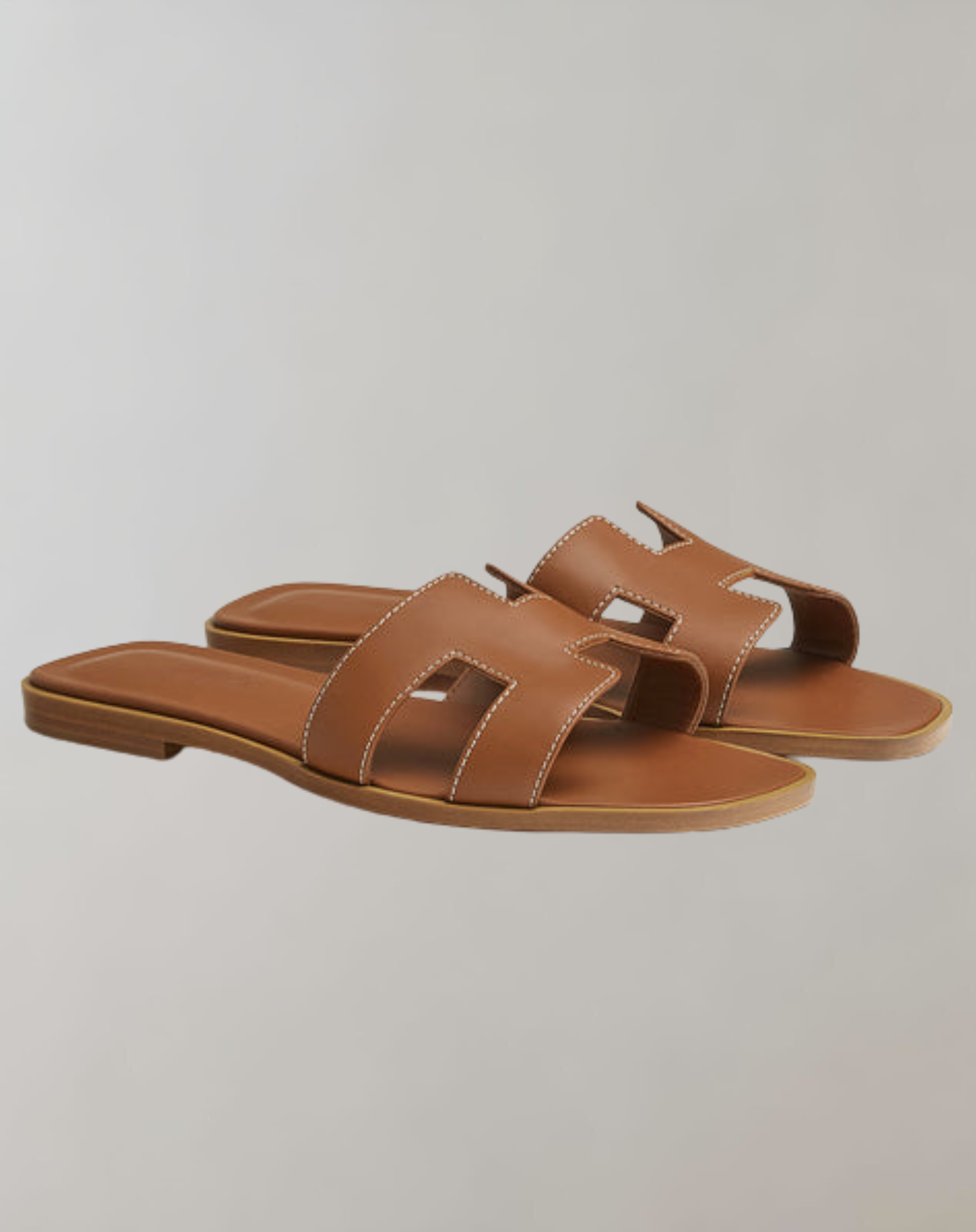 Damen Sandalen aus Leder in Braun, flache Sohle, offenes Design, ideal für Sommermode, bequem und stilvoll, perfekt für Freizeit und Strand.