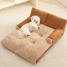 Braunes Cord-Sofa-Haustierbett mit erhöhtem Rückenteil, Hund liegt darauf, gemütlich und warm.