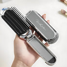 Klappbare Haarbürste aus Metall, silber, tragbar, mit Spiegel, ideal für unterwegs.