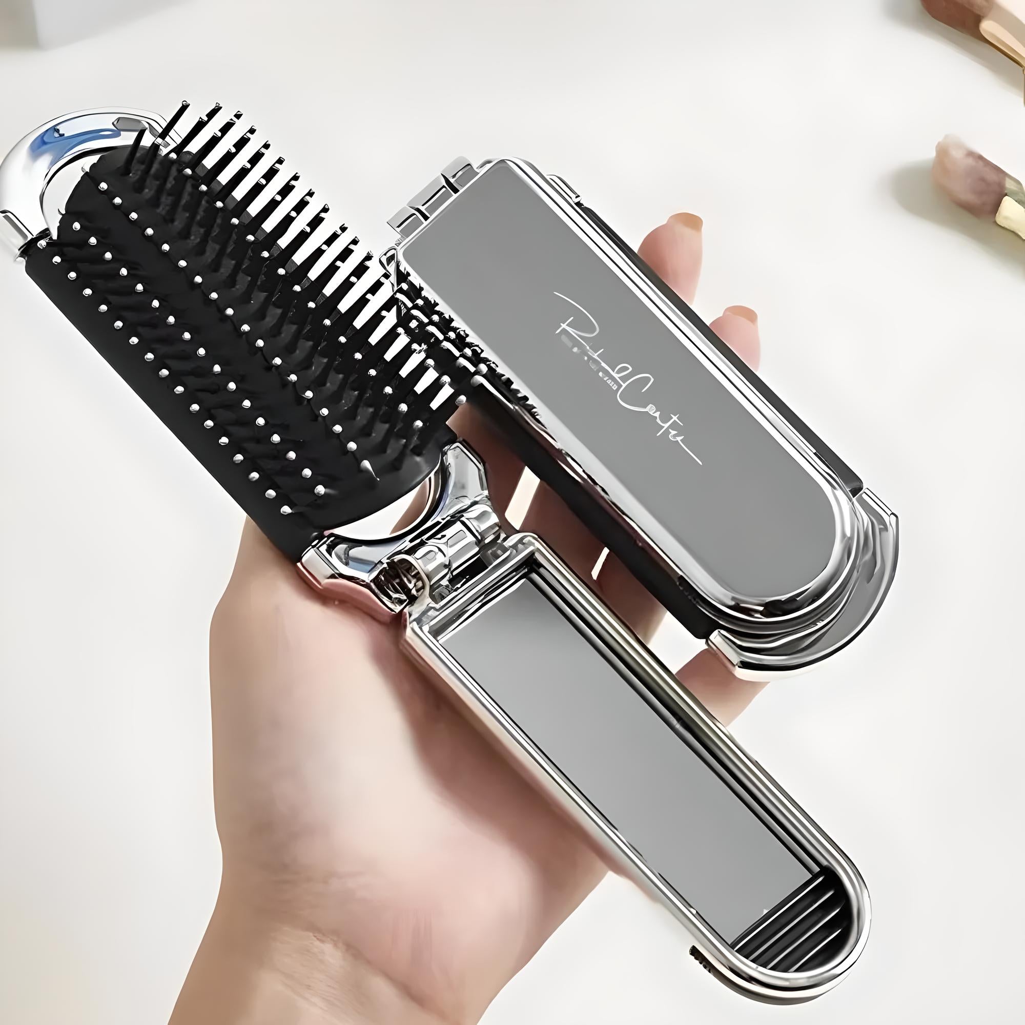 Klappbare Haarbürste aus Metall, silber, tragbar, mit Spiegel, ideal für unterwegs.