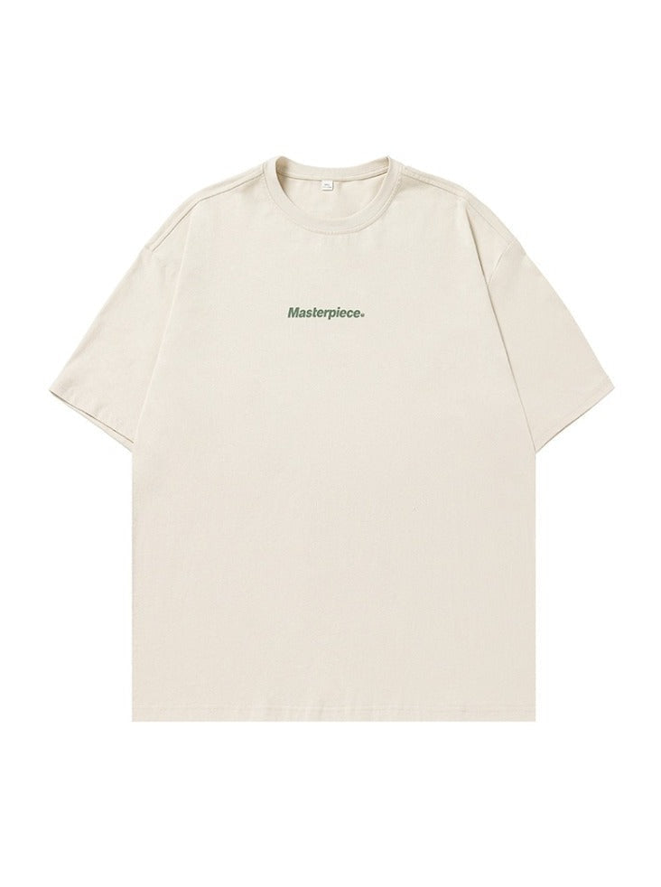 Beiges T-Shirt mit "Masterpiece"-Aufdruck, minimalistisches Design, aus Baumwolle, ideal für lässige Outfits, Unisex-Mode, hochwertig.