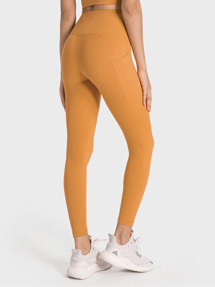 Damen-Sportleggings in Senfgelb, hoch tailliert, nahtloses Design, ideal für Fitness und Yoga. Bequeme Passform, atmungsaktives Material.
