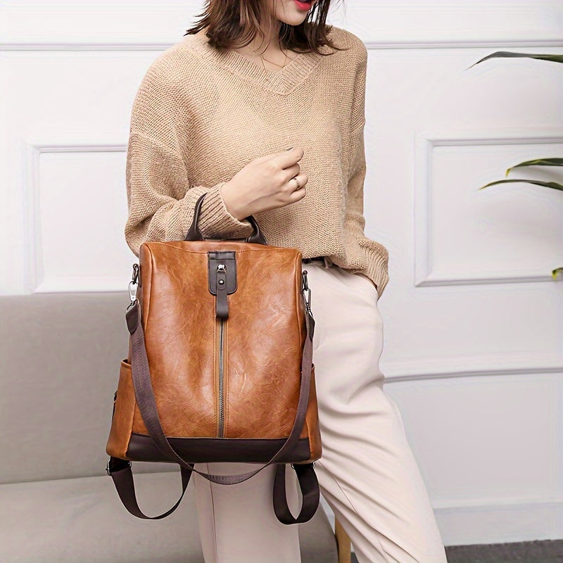Damen-Rucksack aus braunem Leder, stilvoll und geräumig, ideal für Alltag und Reisen. Modischer Begleiter mit verstellbaren Trägern.