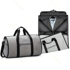 Graue Reisetasche mit Anzugfach, robustes Material, ideal für Geschäftsreisen.