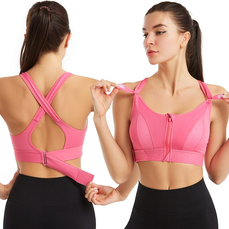 Frau in pinkem Sport-BH mit Reißverschluss, Fitnessbekleidung, Push-up, Plus-Size, Rückansicht.