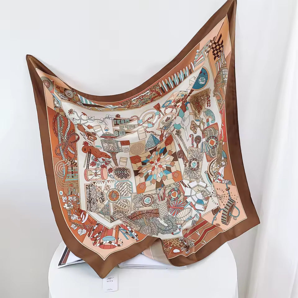 Buntes Seidentuch mit geometrischem Muster, braunem Rand, dekorativ, modisches Accessoire.