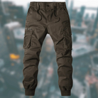Braune Cargohose für Herren, Baumwolle, elastischer Bund, seitliche Taschen, urbaner Stil.
