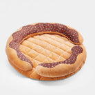 Donut-förmiges, waschbares Hundebett mit Quietschkissen, braun, vielseitig einsetzbar.