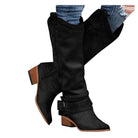 Schwarze Damenstiefel mit Blockabsatz, kniehoch, aus Leder, ideal für Herbstmode. Perfekt kombinierbar mit Jeans für einen trendigen Look.