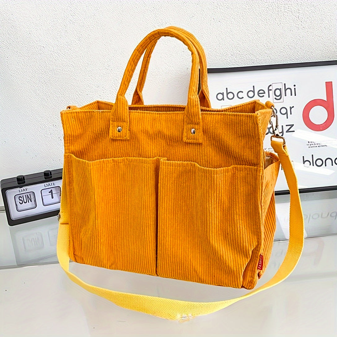 Stylische gelbe Cord-Tasche mit Tragegriffen und Schulterriemen, ideal für den Alltag. Perfekt für Modebewusste und trendige Accessoires.