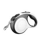 Schwarze und weiße Hundeleine, einziehbar, ergonomischer Griff, robustes Design.