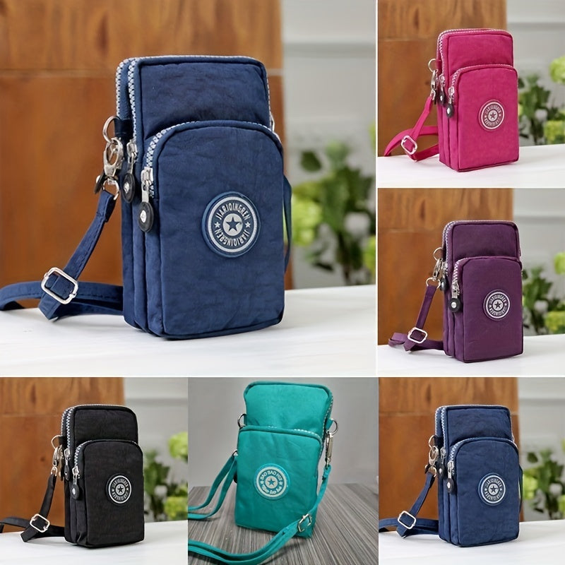 Kompakte Umhängetasche für Damen, erhältlich in Blau, Pink, Lila, Schwarz und Türkis. Ideal für Reisen, mit mehreren Reißverschlussfächern.