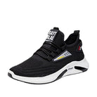 Schwarzer Sportschuh mit weißer Sohle, atmungsaktivem Mesh-Obermaterial und modernem Design. Ideal für Laufen und Fitness.