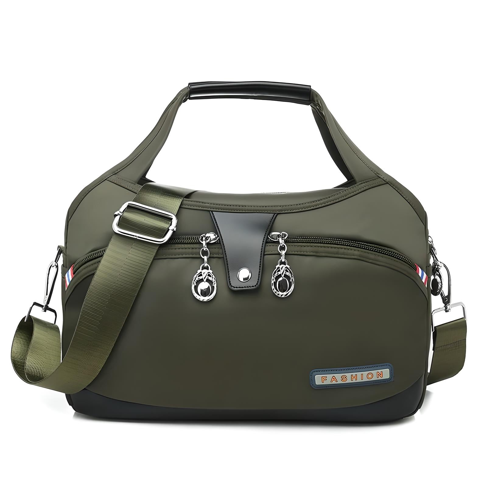 Grüne Damenhandtasche aus Nylon mit verstellbarem Schultergurt und Reißverschlusstaschen.