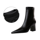 Schwarze Damenstiefelette mit Blockabsatz und spitzer Zehenpartie, aus hochwertigem Leder. Elegante, bequeme Stiefel für Herbst und Winter.
