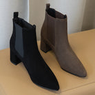 Damen Stiefeletten in Schwarz und Braun, elegantes Design mit Blockabsatz, ideal für Herbstmode. Perfekt für stilvolle Outfits und Komfort.