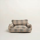 Gestreiftes Hundebett aus weichem Stoff, beige und blau, luxuriöses Design, gemütlich und stilvoll.