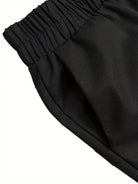 Schwarze Jogginghose mit elastischem Bund, ideal für Sport und Freizeit. Bequeme Passform, hochwertiges Material, vielseitig kombinierbar.