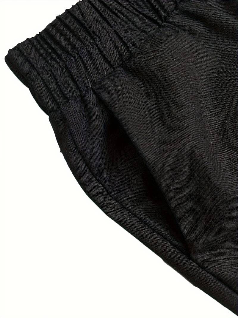 Schwarze Jogginghose mit elastischem Bund, ideal für Sport und Freizeit. Bequeme Passform, hochwertiges Material, vielseitig kombinierbar.