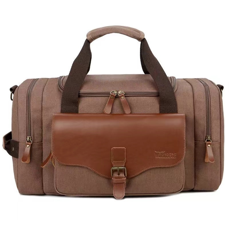 Braune Reisetasche aus Canvas mit Lederakzenten, geräumig, ideal für Reisen und Wochenendausflüge.