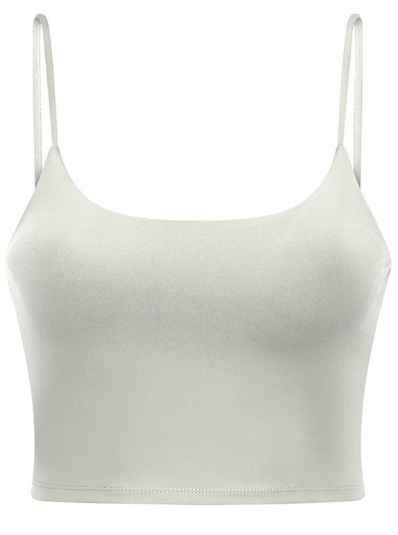 Damen Crop Top in Weiß mit Spaghettiträgern, nahtloses Design, ideal für Sommermode, bequem und vielseitig kombinierbar. Perfekt für Casual-Looks.