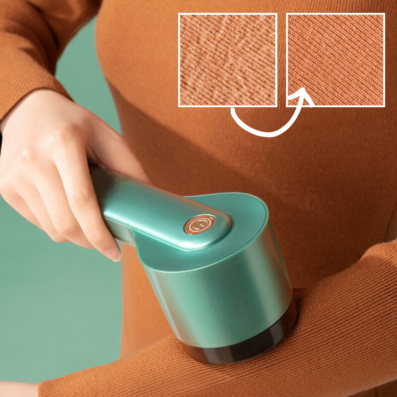 Elektrischer Fusselentferner in Grün, entfernt effektiv Fusseln von Kleidung. Ideal für Pulloverpflege. Hochwertiges Design, einfach zu bedienen.