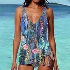 Bunter Badeanzug mit floralen Mustern, ideal für Strandurlaub. Hochwertige Materialien, modisches Design, perfekte Passform für Damen.